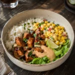 High protein corn chicken rice bowls meal prep with seasoned chicken, rice, and street corn