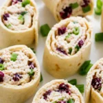 Chicken cranberry pinwheels sliced on a plate